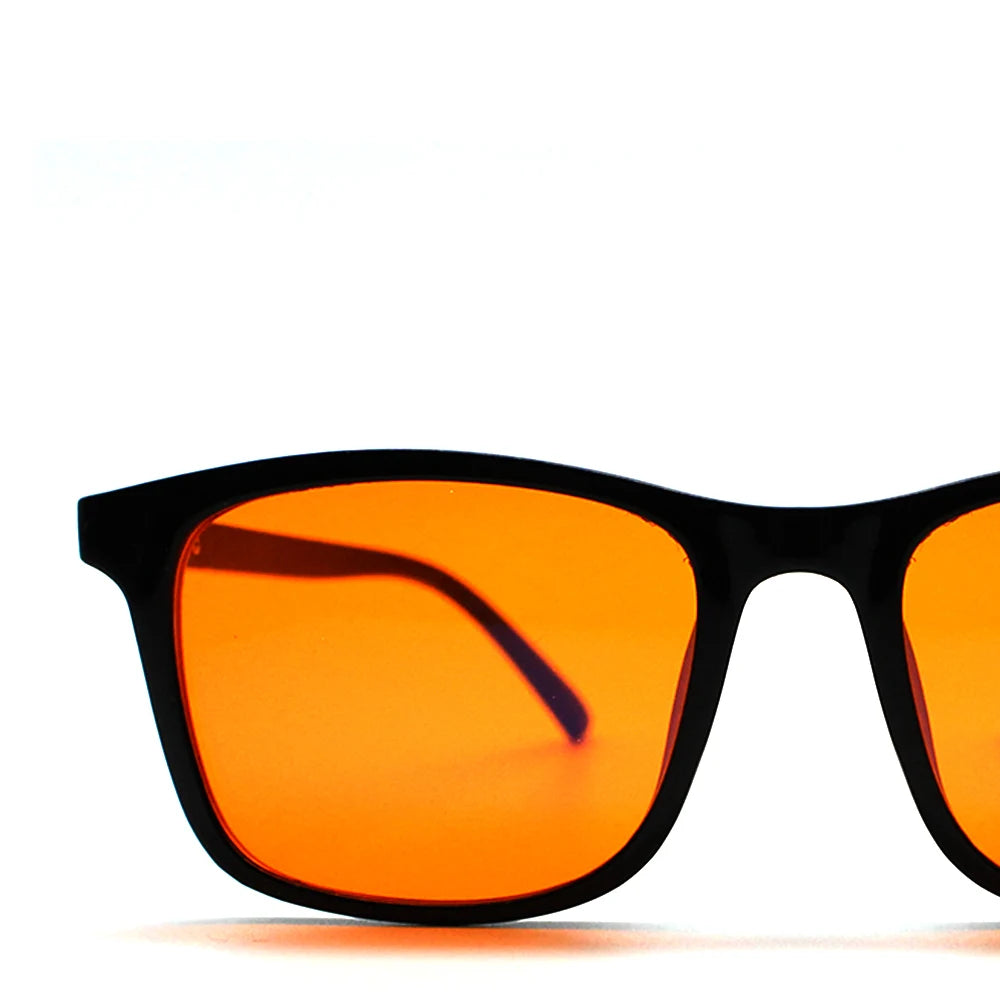 New blue light blocking glasses with red and orange lenses for fatigue protection and fashionable design wearing during gaming